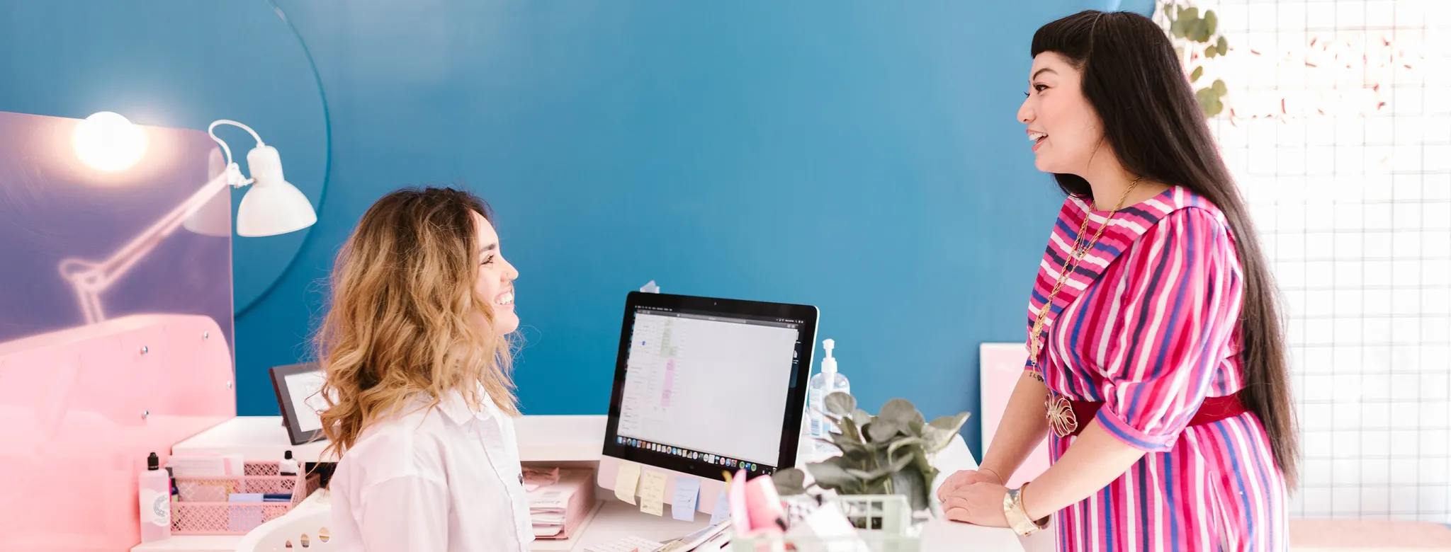 two women at desk in salon spa