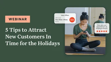 Person on mobile device sitting on a yoga mat