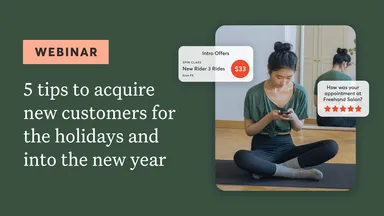 Person on mobile device sitting on a yoga mat