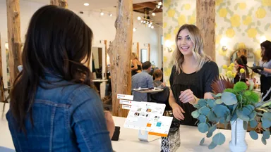 woman checking out at front desk of salon spa