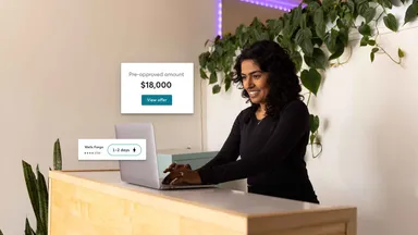 woman at desk with laptop 