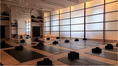 Ebb & Flow Yoga Studio with mats on the floor and blocks.
