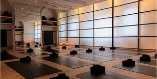 Ebb & Flow Yoga Studio with mats on the floor and blocks.