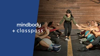 Mindbody + ClassPass with instructor giving high-fives