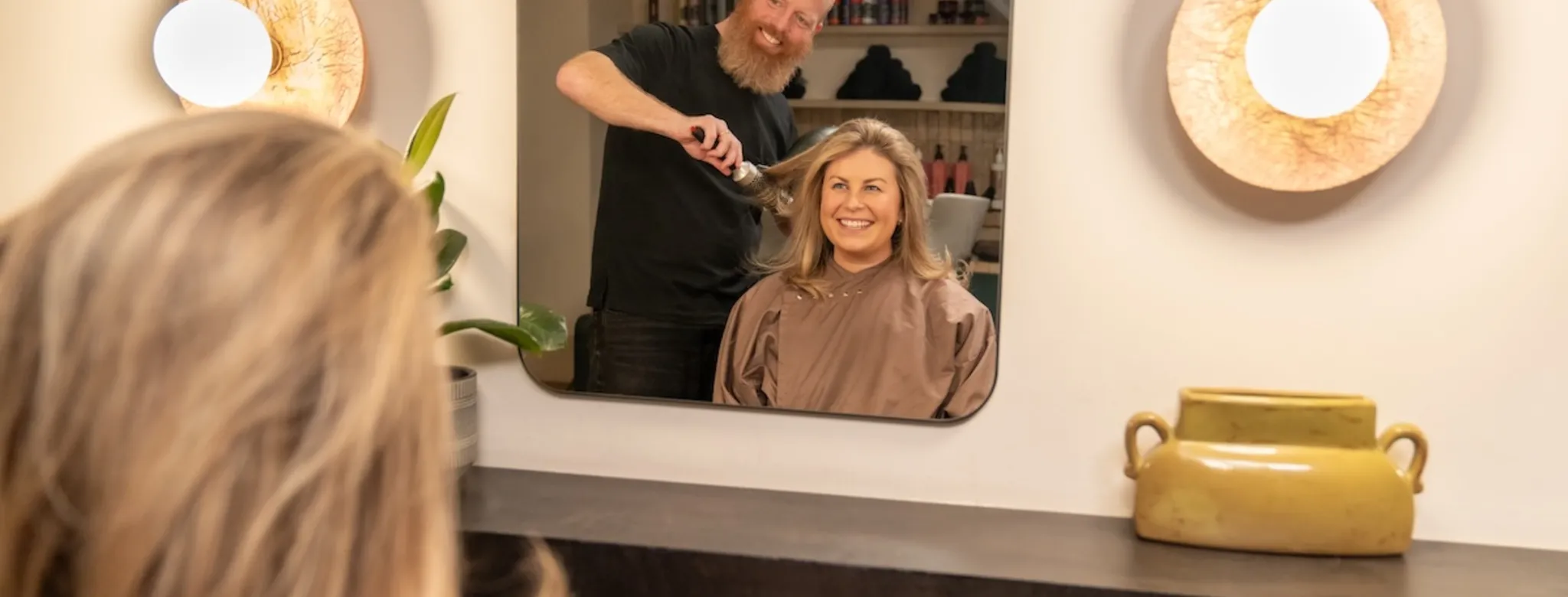 A woman getting her hair done at the salon