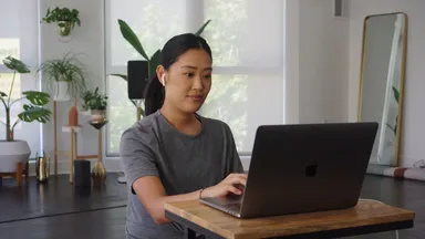 woman on her laptop in living room