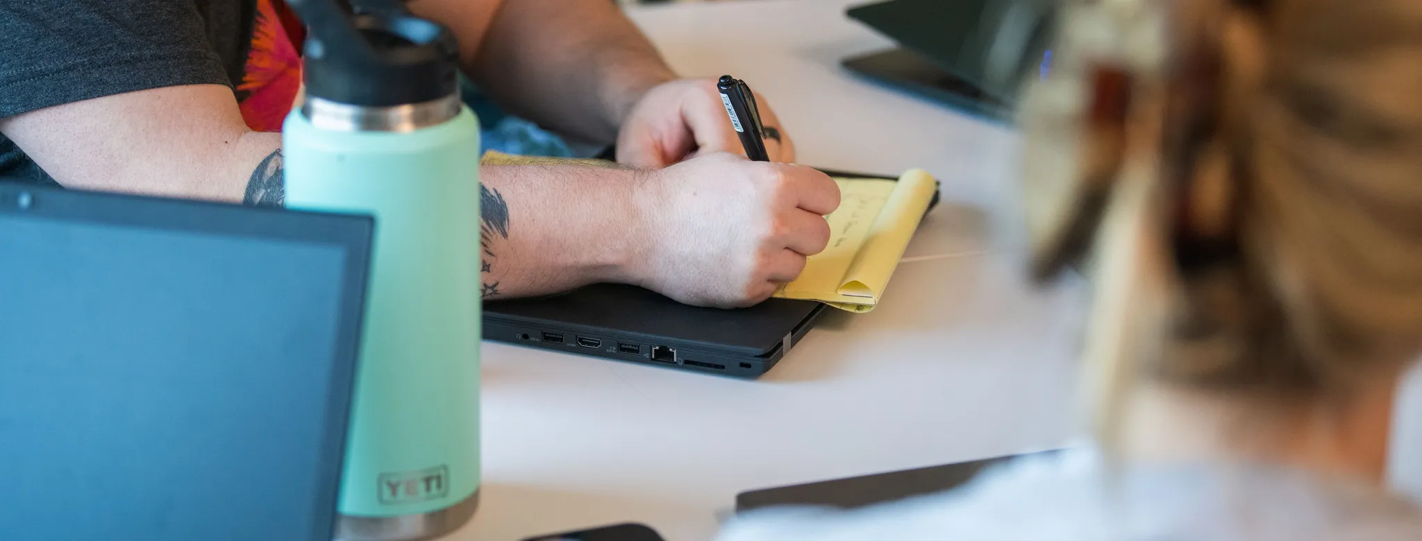 Taking notes with coworkers