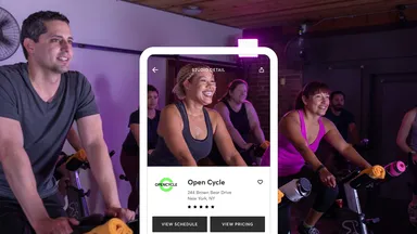 man and women working out in a spin class