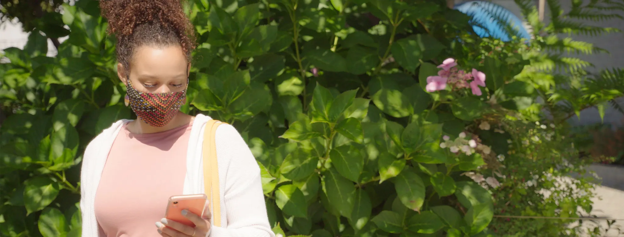 Woman in a mask on her phone