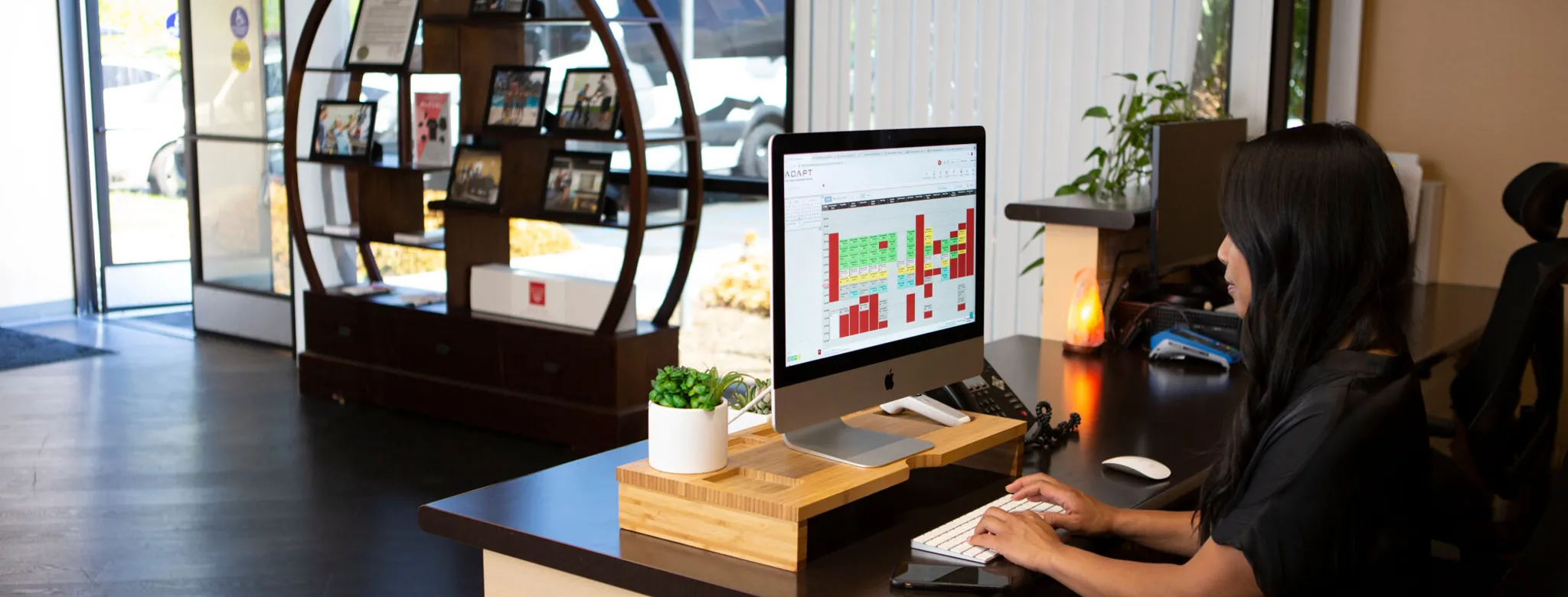 woman sitting at desk working on computer