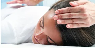Person laying on massage table
