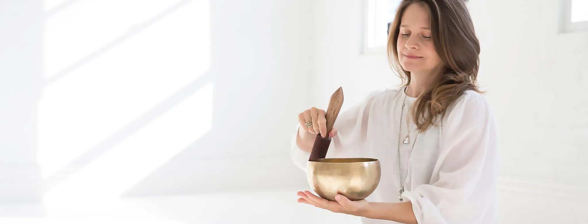 A woman giving a soundbath