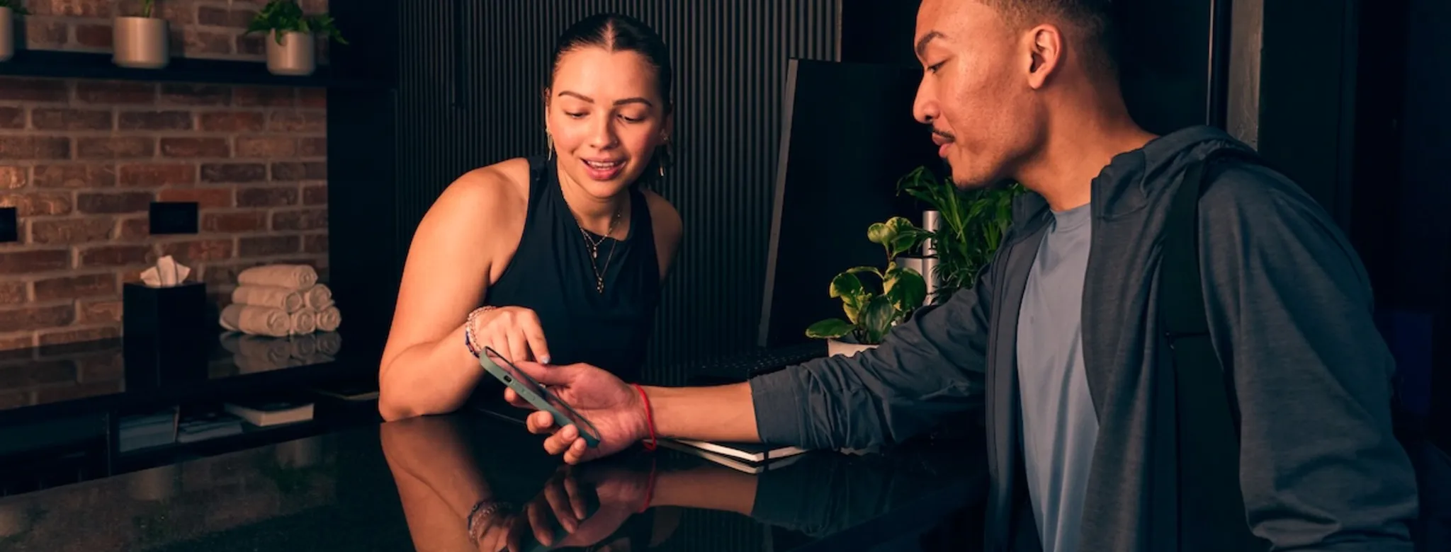 Two people at a fitness studio