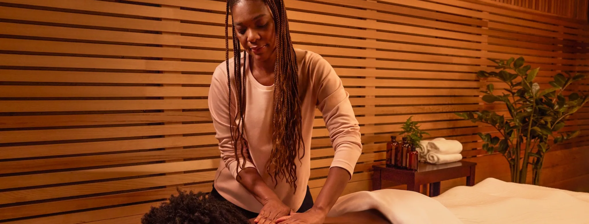 A client receiving a massage at a spa. 