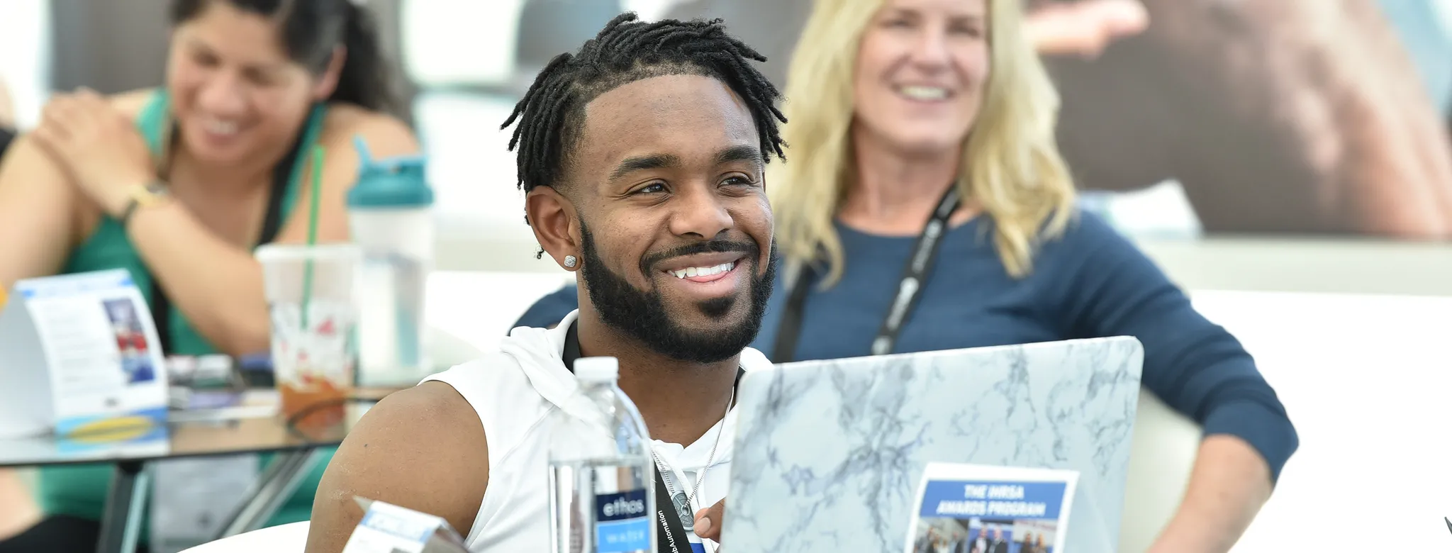 man smiling at table at ihrsa