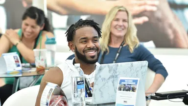man smiling at table at ihrsa