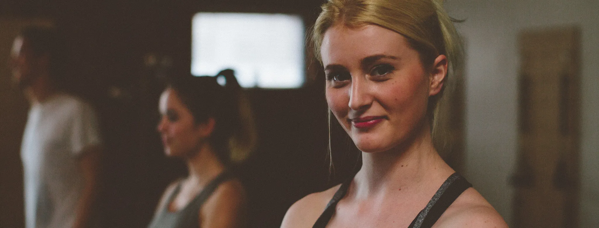 Smiling woman in fitness studio
