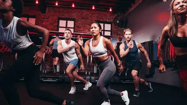 A woman doing cardio at Kyle House Fitness