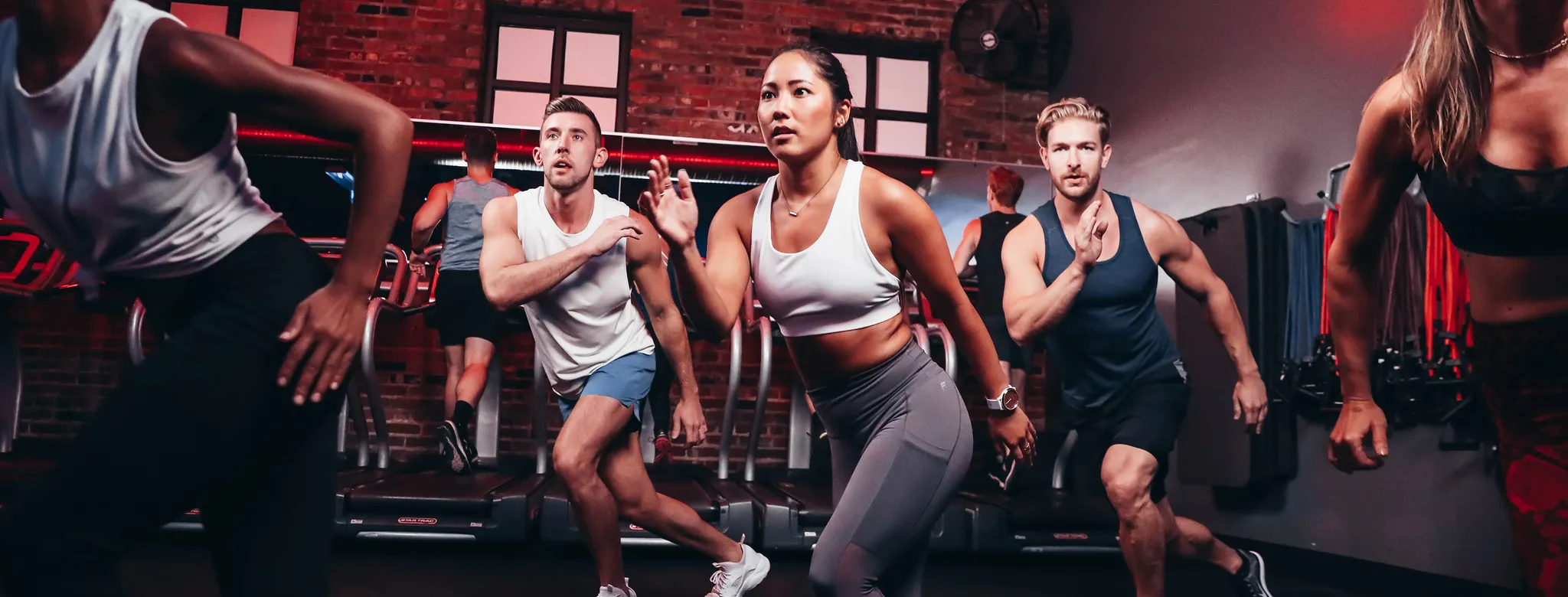 A woman doing cardio at Kyle House Fitness