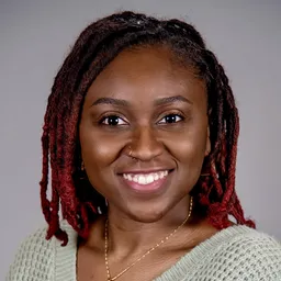 A headshot photo of Ma-Keba Frye