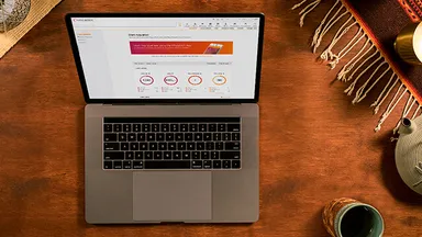 laptop on desk with Mindbody report