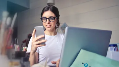 Woman working on her phone.