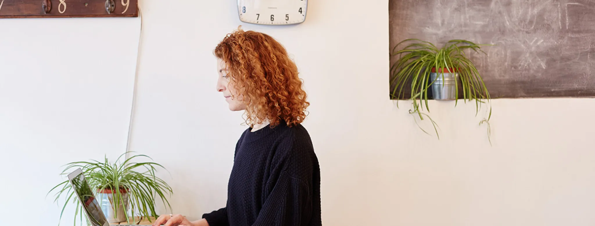 woman a front desk using laptop