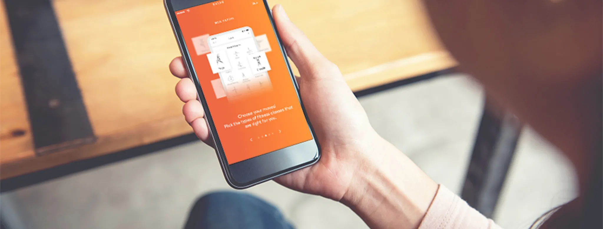 Woman using the MINDBODY app