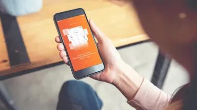 Woman using the MINDBODY app