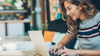 Woman looking at laptop