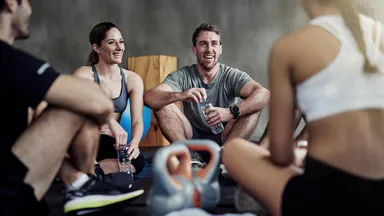 Happy people with kettlebells