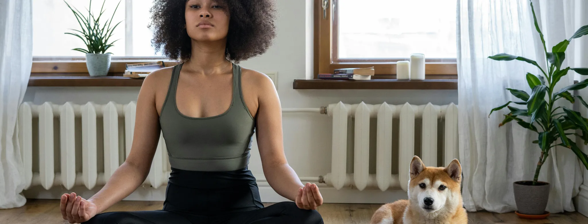 yoga studio owner on mat with her dog