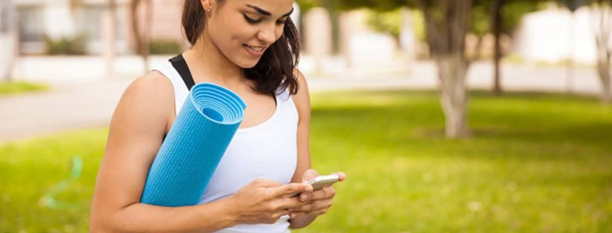 Woman on phone after yoga class