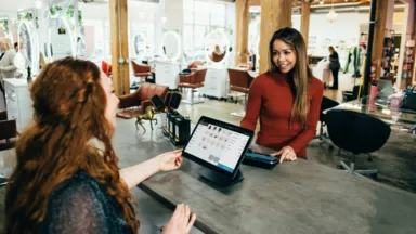 Woman checking in at hair salon