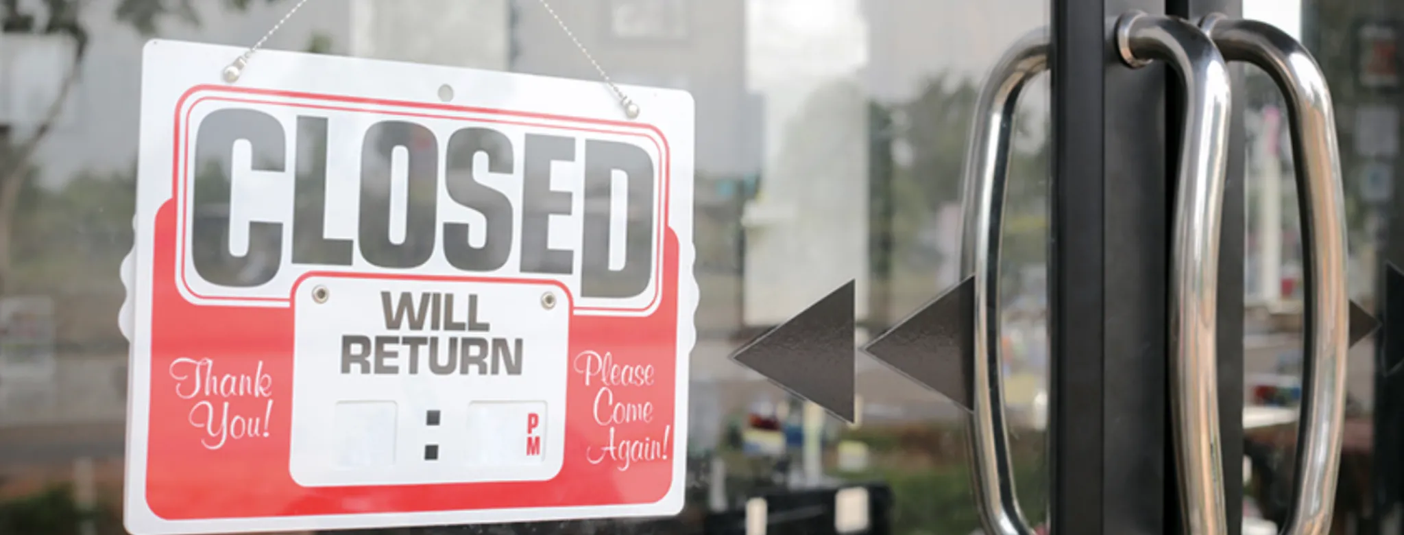 business door with closed sign