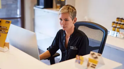 A business owner uses Mindbody software