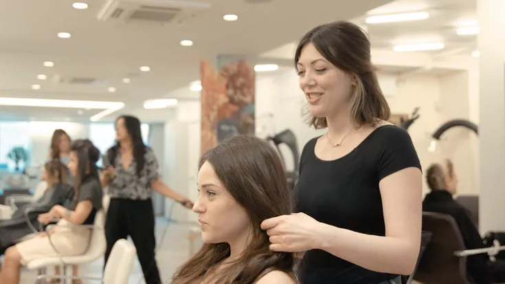 A stylist and client at Takamichi Hair