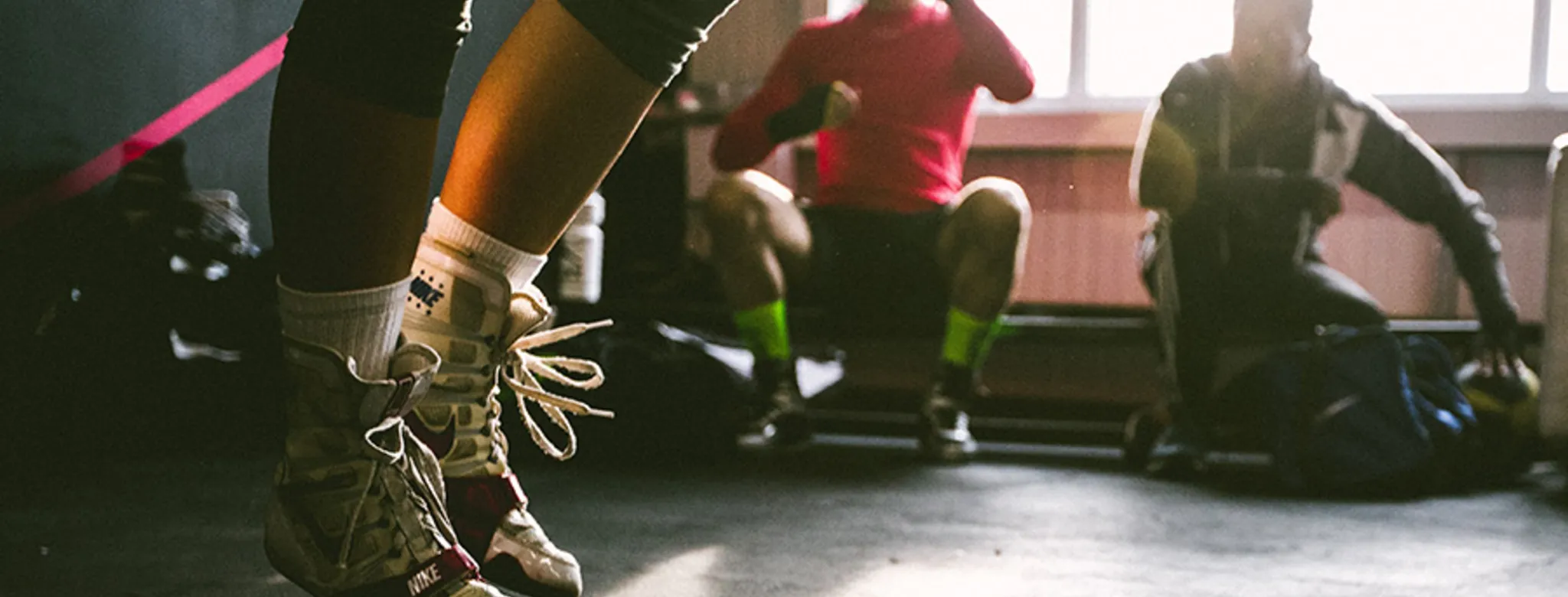 three men working out in a gym