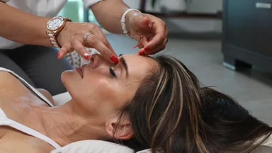 woman enjoying service from spa menu