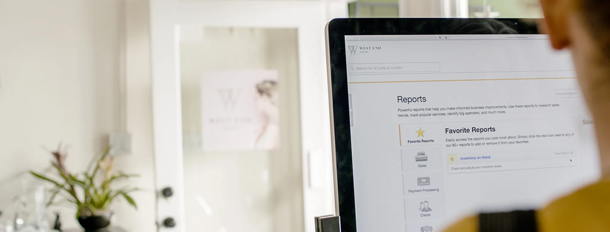 Woman pulling reports with her business management software